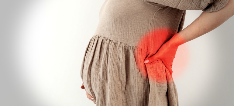 Болит поясница при беременности